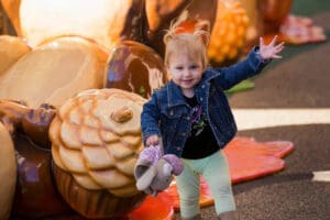 girl in front of acorn at avalon mall