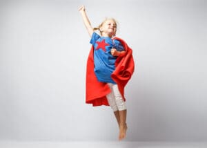 girl dressed as superhero