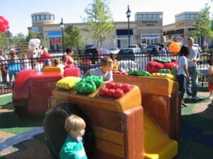 families enjoying alamance crossing play area