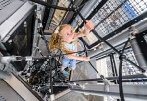 girl climbing on skycourse equipment