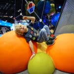 boy playing on interactive challenge course