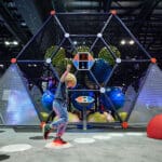child playing in indoor new hive play structure