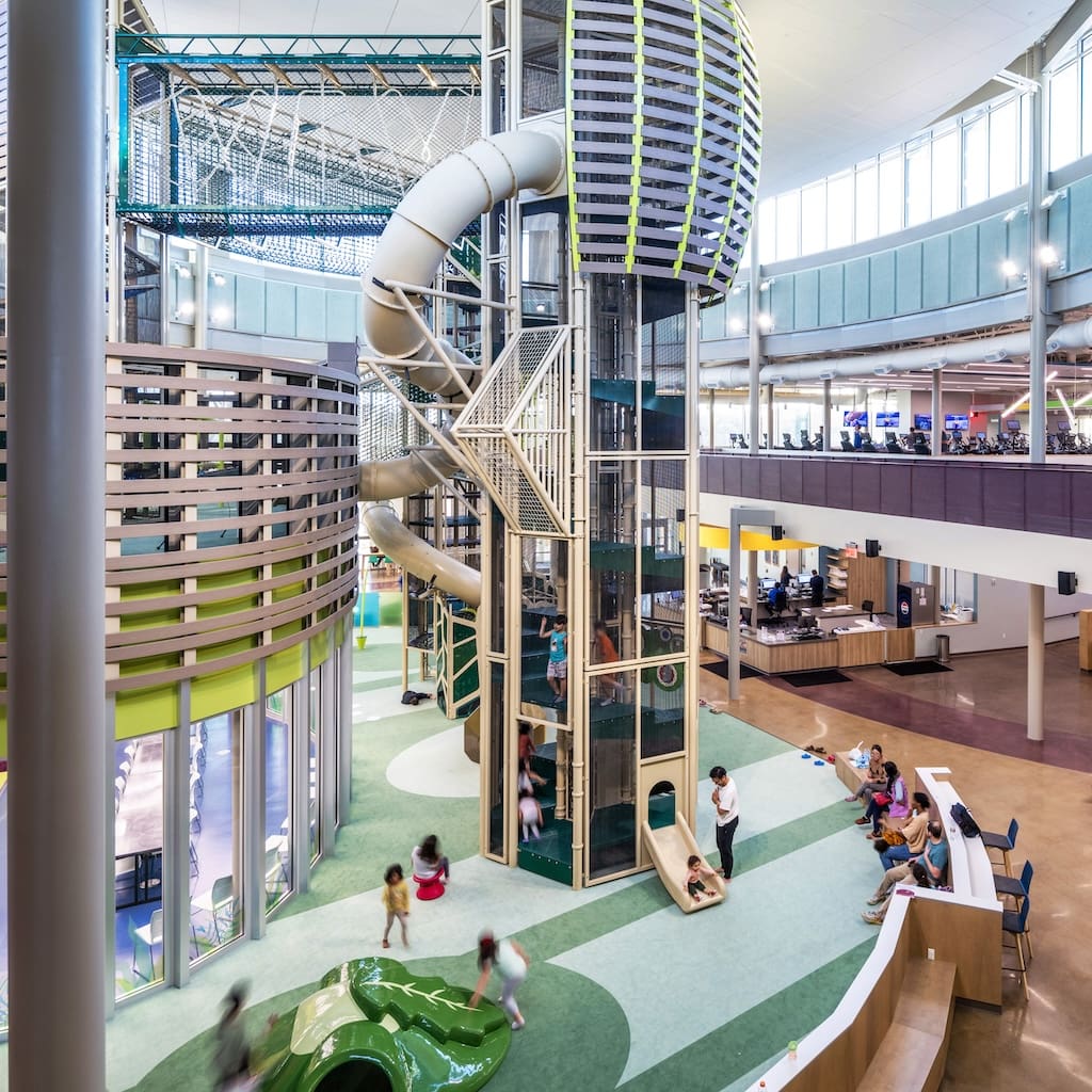 photo of Stephen G. Terrell Recreation Center interior, climbing tower with spiral slide, soft sculpture play around on the ground floor